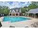 Outdoor pool featuring lounge chairs, a covered pavilion, and well-maintained surroundings at 2015 Samuel Close Ct, Alpharetta, GA 30009