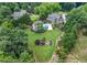 Aerial view highlighting the property's extensive landscaping, pool area, and privacy at 407 Maple Ridge Ct, Cumming, GA 30028