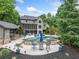 Gorgeous backyard featuring a private pool, outdoor kitchen, and meticulous landscaping at 407 Maple Ridge Ct, Cumming, GA 30028