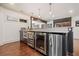 Finished basement bar with coolers, ample counter space, and hardwood floors at 407 Maple Ridge Ct, Cumming, GA 30028