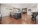 Finished basement with a bar, coolers, and seating area at 407 Maple Ridge Ct, Cumming, GA 30028