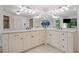 Elegant bathroom with dual vanities, marble countertops, and a large mirror with decorative lighting at 407 Maple Ridge Ct, Cumming, GA 30028