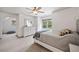Spacious bedroom with a ceiling fan, white furniture, and tree views at 407 Maple Ridge Ct, Cumming, GA 30028