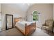 Comfortable bedroom with vaulted ceiling, chair, and large window at 407 Maple Ridge Ct, Cumming, GA 30028