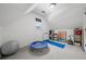 Finished bonus room provides versatile space for recreation or hobbies at 407 Maple Ridge Ct, Cumming, GA 30028