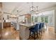 Spacious kitchen with a kitchen island, barstool seating, and an open floor plan at 407 Maple Ridge Ct, Cumming, GA 30028