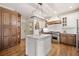 Well-appointed kitchen featuring custom cabinetry, a kitchen island, and stainless steel appliances at 407 Maple Ridge Ct, Cumming, GA 30028