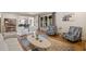 Open concept living room with a fireplace, hardwood floors, and natural light throughout at 407 Maple Ridge Ct, Cumming, GA 30028