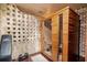Inviting cedar sauna room features modern design elements and bench at 407 Maple Ridge Ct, Cumming, GA 30028