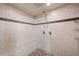 Modern shower with rainfall showerhead, built-in bench, and designer tile accents at 407 Maple Ridge Ct, Cumming, GA 30028