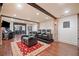 Spacious theater room with comfortable seating, hardwood floors, and game area at 407 Maple Ridge Ct, Cumming, GA 30028