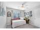 Bedroom featuring soft natural light, neutral color palette, ceiling fan, and unique furnishings at 1945 Barrett Dr, Cumming, GA 30040