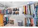 Walk-in closet with an extensive hanging system, shelving, and space for shoes, hats, and accessories at 1945 Barrett Dr, Cumming, GA 30040