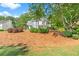 A charming two-story home with blue siding, landscaping, and mature trees at 1945 Barrett Dr, Cumming, GA 30040