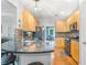 Well-lit kitchen featuring wood cabinetry, granite counters, breakfast bar and stainless steel appliances at 1945 Barrett Dr, Cumming, GA 30040