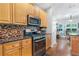 Bright kitchen featuring stainless steel appliances, granite countertops, and wood cabinets at 1945 Barrett Dr, Cumming, GA 30040
