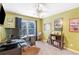 Home office featuring a large desk, window view, and neutral carpeting at 1945 Barrett Dr, Cumming, GA 30040