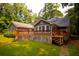 View of the back exterior with a wooden deck and lawn at 20 Lisa Ct, Stockbridge, GA 30281