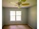 Cozy bedroom featuring natural light and ceiling fan at 20 Lisa Ct, Stockbridge, GA 30281