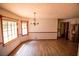 Dining room featuring wood look floors, and natural light from a large window at 20 Lisa Ct, Stockbridge, GA 30281