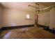 Empty garage with bare walls, a window, and stairs to an upper-level door at 20 Lisa Ct, Stockbridge, GA 30281
