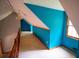 Well-lit hallway with hardwood railing and colorful walls at 20 Lisa Ct, Stockbridge, GA 30281