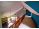 Bright, spacious hallway overlooking the living area, featuring hardwood railing at 20 Lisa Ct, Stockbridge, GA 30281