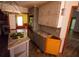Partial view of a kitchen with an island, wooden cabinets, and grey countertops at 20 Lisa Ct, Stockbridge, GA 30281