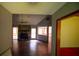 Open-concept living room with vaulted ceiling, stone fireplace, and lots of natural light at 20 Lisa Ct, Stockbridge, GA 30281