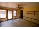Living room features carpeted floor, wood trim and door to exterior at 20 Lisa Ct, Stockbridge, GA 30281