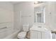 Bathroom with a tub/shower combo, toilet, sink and vanity at 310 Wolf Downs Way, Atlanta, GA 30349
