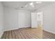 This bedroom has wood floors, two closets, and views into an adjacent room at 310 Wolf Downs Way, Atlanta, GA 30349