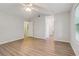 Bedroom featuring light walls, laminate floors, and a window at 310 Wolf Downs Way, Atlanta, GA 30349