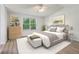 Cozy bedroom with natural light, vaulted ceiling, and wood-look floors at 310 Wolf Downs Way, Atlanta, GA 30349