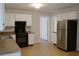 Well-equipped kitchen featuring white cabinets, modern appliances, and ample counter space at 310 Wolf Downs Way, Atlanta, GA 30349