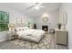 Bright main bedroom with a fireplace, vaulted ceiling, large windows, and elegant decor at 310 Wolf Downs Way, Atlanta, GA 30349