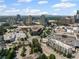 An aerial view capturing the surrounding city, including a shopping center, streets, and an assortment of buildings at 3630 Peachtree Ne Rd # 2408, Atlanta, GA 30326