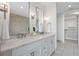 Bathroom with marble countertops and double sinks; walk-in closet in background at 3630 Peachtree Ne Rd # 2408, Atlanta, GA 30326
