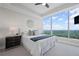 Airy bedroom features a large window with stunning views and tray ceiling detail at 3630 Peachtree Ne Rd # 2408, Atlanta, GA 30326