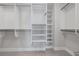 Walk-in closet includes shelving with hanging rods, maximizing organization and storage capabilities to keep belongings organized and accessible at 3630 Peachtree Ne Rd # 2408, Atlanta, GA 30326