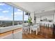 Open concept dining room with city view and kitchen with bar seating at 3630 Peachtree Ne Rd # 2408, Atlanta, GA 30326