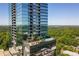 Exterior view featuring the building's terrace with a serene pool and lush green trees in the background at 3630 Peachtree Ne Rd # 2408, Atlanta, GA 30326