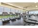 A modern gym equipped with treadmills, weights, and fitness equipment with city views from the large windows at 3630 Peachtree Ne Rd # 2408, Atlanta, GA 30326
