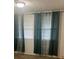 Bedroom featuring curtains and an overhead light at 3785 Somerset Sw Dr, Marietta, GA 30064
