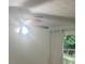 Bright bedroom featuring a ceiling fan and a window with view of lush greenery at 3785 Somerset Sw Dr, Marietta, GA 30064