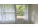Bedroom with window and sheer patterned curtains at 3785 Somerset Sw Dr, Marietta, GA 30064