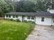 One-story home with a dark roof, white exterior and an ample lawn at 3785 Somerset Sw Dr, Marietta, GA 30064
