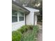 Side exterior with gutter and established garden at 3785 Somerset Sw Dr, Marietta, GA 30064