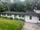 One-story home with a dark roof and a lawn that requires maintenance at 3785 Somerset Sw Dr, Marietta, GA 30064