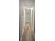 A long hallway with wood-look flooring leads to other areas of the home at 3785 Somerset Sw Dr, Marietta, GA 30064
